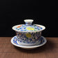 Blue and white doucai covered bowl with scrolling floral design