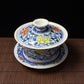 Blue and white doucai covered bowl with scrolling floral design