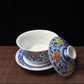 Blue and white doucai covered bowl with scrolling floral design