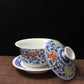 Blue and white doucai covered bowl with scrolling floral design